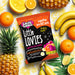 Packet of Caring Candies sugarfree Little Lovies assorted citrus flavoured sweets surrounded by fruits on a colorful background