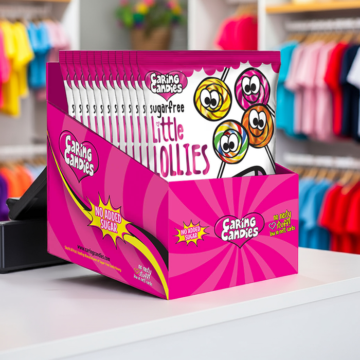 Box of Caring Candies Little Lollies on a shelf with colorful clothing in the background