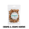 Packaged sugarfree caramel and sesame cashews with a label on a clear background