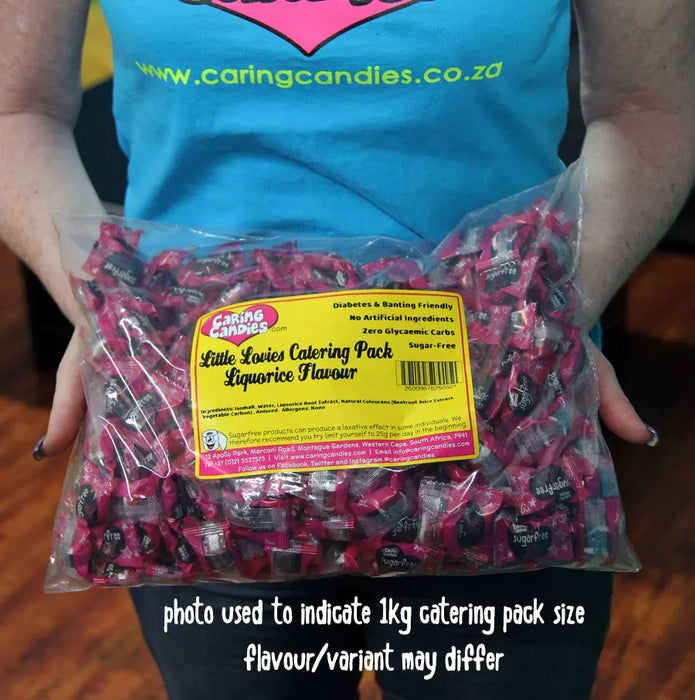 Person holding 1kg Bulk Catering Pack of Caring Candies Little Lovies Sweets showing the size