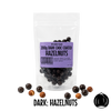 Packaging of  no added sugar dark chocolate-coated hazelnuts with a purple label on a white background.