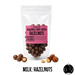 Packaged no added sugar milk chocolate-coated hazelnuts with a pink label on a white background