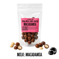 Packaged no added sugar milk chocolate-coated macadamia nuts with a pink label on a white background.