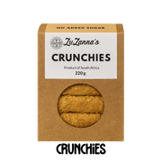 Box of ZuZanna's Sugarfree Crunchies with a clear window showing the cookies inside on a clear background.