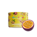 A yellow tub of Footys Passionfruit Sugar Free Powdered Drink mix next to a fresh halved passionfruit on a white background.