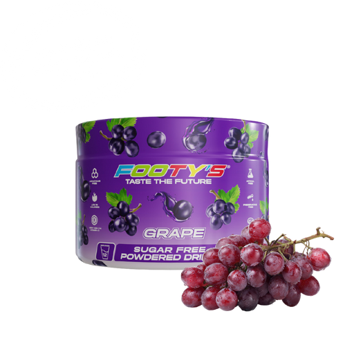A purple tub of Footys Grape flavour sugar free powdered drink mix, shown next to a fresh cluster of red-purple grapes on a plain white background.