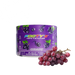 A purple tub of Footys Grape flavour sugar free powdered drink mix, shown next to a fresh cluster of red-purple grapes on a plain white background.