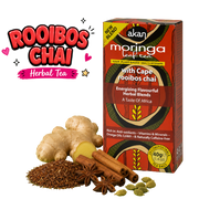 A box of Akan Moringa Leaf Tea Rooibos Chai flavor shown next to loose ingredients including ginger, cinnamon, star anise, cardamom, and a pile of rooibos tea leaves, with a 'Rooibos Chai Herbal Tea' text graphic on a white background.