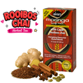 A box of Akan Moringa Leaf Tea Rooibos Chai flavor shown next to loose ingredients including ginger, cinnamon, star anise, cardamom, and a pile of rooibos tea leaves, with a 'Rooibos Chai Herbal Tea' text graphic on a white background.