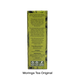 The back of a Moringa Tea Original box, showing product information, storage instructions, and preparation details in white text over a green and yellow patterned background, on a white studio background with 'Moringa Tea Original' printed below.