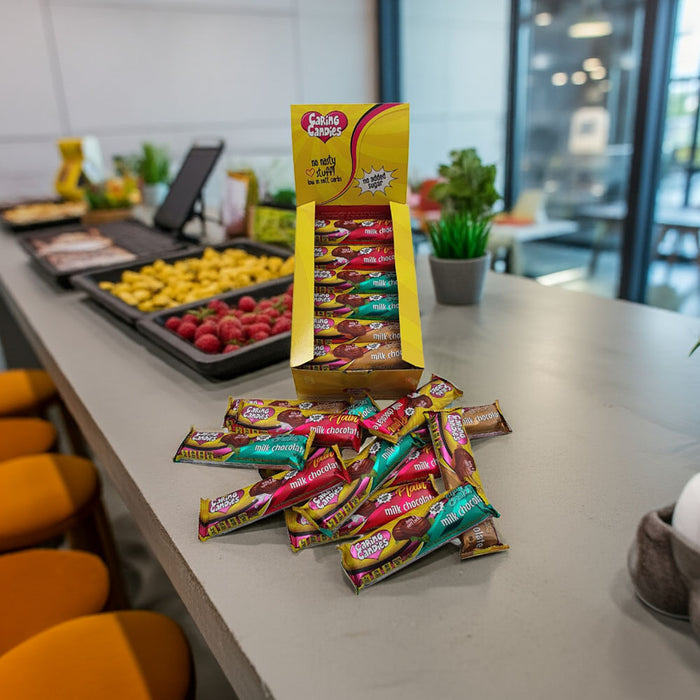 An assorted retail display box of 30 50g caring candies sugar-free premium milk chocolate bars - milk, mint, and toffee flavours
