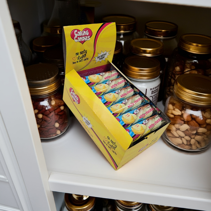 A retail display box of 30x50g caring candies sugar-free premium white chocolate bars with banana flavoured crunch