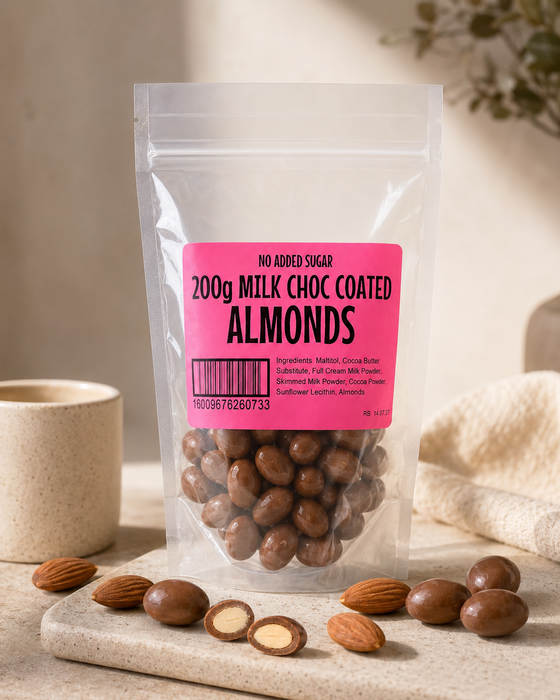 Packaged no added sugar milk chocolate coated almonds with a pink label on a neutral background