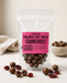 Packaged no added sugar milk chocolate coated cranberries with a pink label on a light background