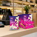 Caring Candies No-Added-Sugar Strawberry flavouredLittle Luvbites packaging on a store checkout counter 
