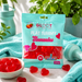 Packaging of Gloot Sugarfree Flat Tummy Gummies with gummies around on a light blue towel.