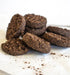 Chocolate cookies on a white surface with a blurred background