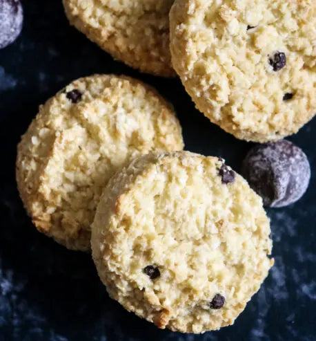 Biscuits with chocolate chips on a dark surface