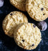 Biscuits with chocolate chips on a dark surface