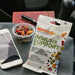 Montagu immune support snack mix packet on a car dashboard with phone and bowl of nuts.