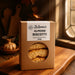 Box of Zuzanna's Sugarfree Almond Biscotti on a wooden surface with a warm background