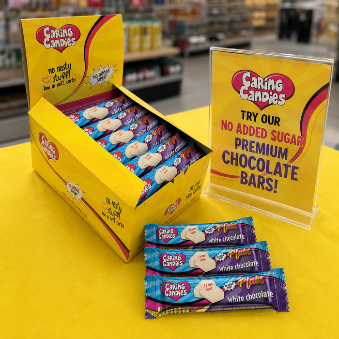 Caring Candies display with packaging and promotional sign in a store setting