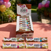 Display of EVRY1 snack bars with a colorful outdoor background