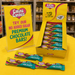 Caring Candies chocolate bars with promotional sign on a yellow table