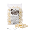 Packet of Glutenfree Pasta Regalo macaroni with uncooked macaroni in front of it