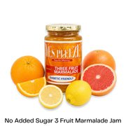 Bottle of Yes Pleeze No Added Sugar three fruit marmalade Jam with fresh oranges, grapefruit and lemon scattered around the bottom