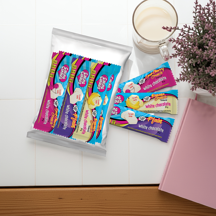 Assorted caring candies premium sugar-free chocolate bars with a cup of coffee and pink notebook on a white surface